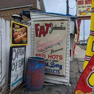 a sign for a hot dog shop