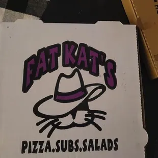 a pizza box with a sticker on it