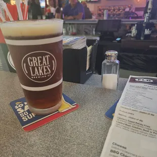 a pint of beer on a table