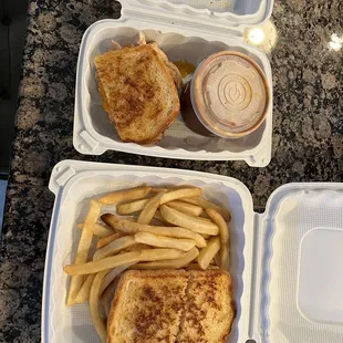 Crab sandwich with fries and half crab half chili.