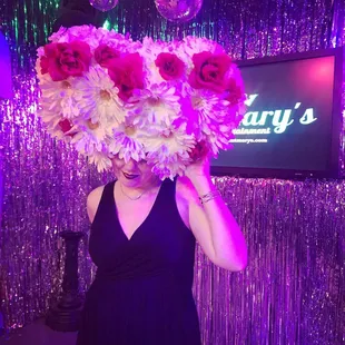  a woman holding a bouquet of flowers