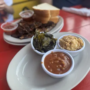 Full rack of ribs with sides of mac n cheese, collard greens, and baked beans