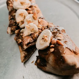a flatbread with bananas and peanut butter