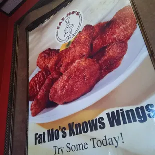 a poster of wings on a wall