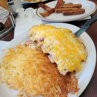 Best hash browns and Mom&apos;s Eggs (scrambled with cheese over English Muffin).