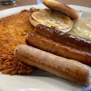 Two eggs, sausage links, hash browns and English muffin