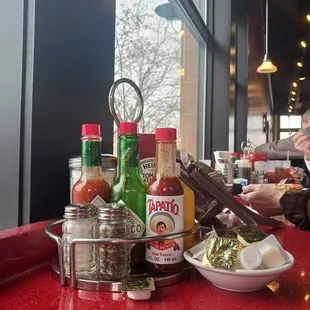 Condiments to be shared with your neighbor at the high counter