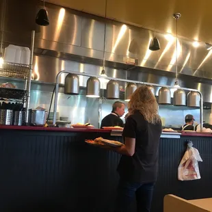 a woman holding a tray of food