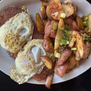 Corned beef hash with over medium eggs