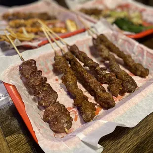 several skewered meats on skewers