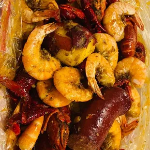 a plastic container filled with shrimp and shrimp