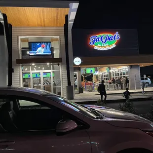 a car parked in front of the restaurant