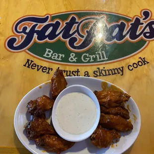 a plate of chicken wings