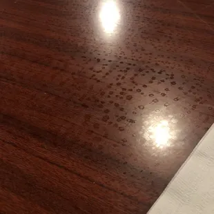Grease and smelly dirty water marks on table we were set at.