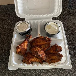 chicken wings in a styrofoam container