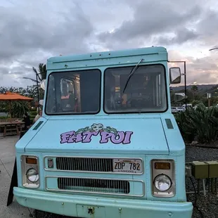 a blue van with graffiti on it