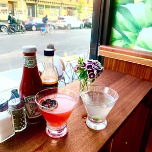 two cocktails on a wooden table