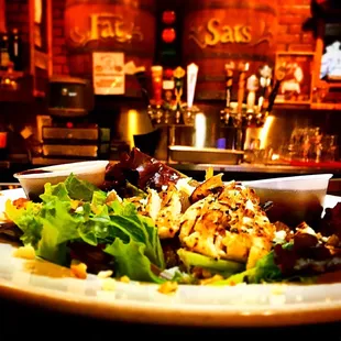 Fat Sat&apos;s baby green, with grilled chicken.
