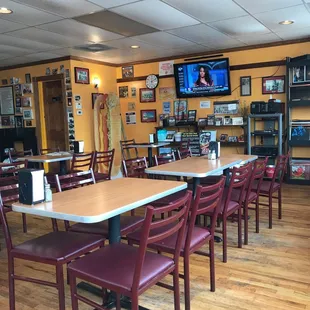 a dining area with tables and chairs