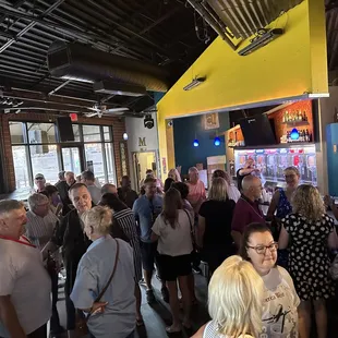 a large group of people standing in line