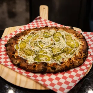 a pizza on a wooden board