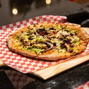 a pizza on a cutting board