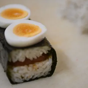 three eggs on top of rice