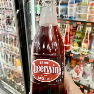 a hand holding a bottle