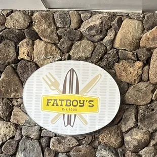 a sign on the wall of a restaurant