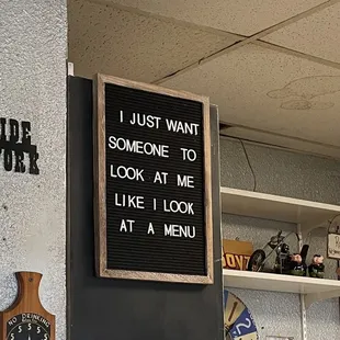 a sign that says i just want someone to look at me like i look at a menu