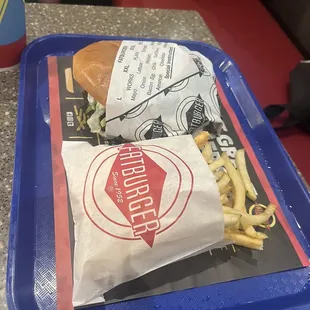 a sandwich and fries on a tray