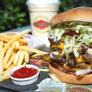 XXXL bacon cheeseburger with skinny fries and a milkshake at Fatburger!