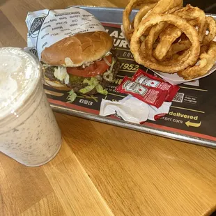 This the large burger meal with a cookies and cream shake and cheese added to the burger and onion rings instead of fries....$22.17