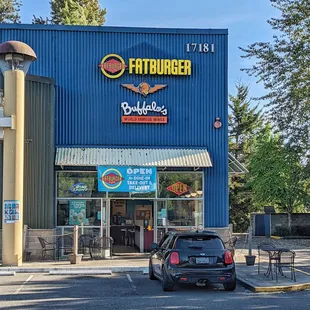 a car parked in front of the restaurant