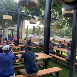 Beer garden features family style picnic tables good also has corn hole on the lawn (not photographed)