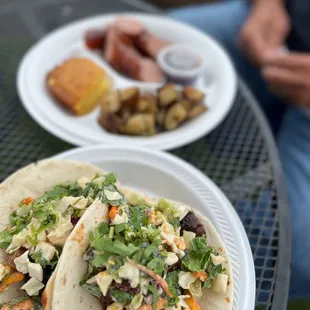 Burnt ends tacos and BBQ sausage plate.