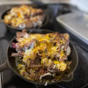 two skillets on a stove