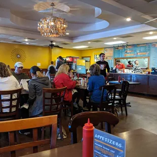 a large group of people sitting at tables