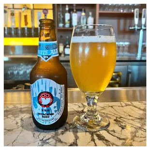 a bottle and a glass of beer