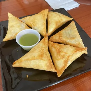 a plate of samata with dipping sauce