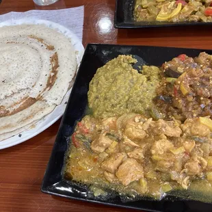 Veggie stews (eggplant and lentil) and chicken with the somali injera bread