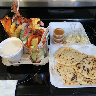 Fruit explosion on the left. Chicken pupusas on the right. Absolutely delicious !!