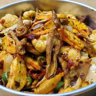 a bowl of stir fried vegetables