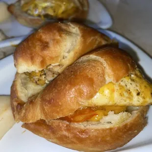 a croissant sandwich on a plate