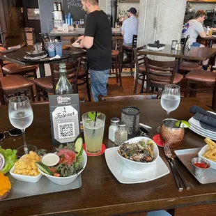 View of the table behind the gentleman where we were initially seated between them and the bar which is just too narrow.