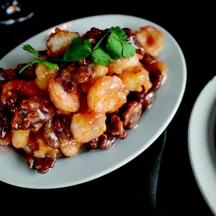 Honey Walnut Chicken: lightly fried and glazed with honey sauce, walnuts, and sesame seeds