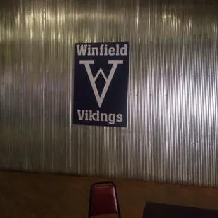 a chair in front of a sign that says whitfield vikings