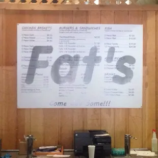 a menu on the wall of a restaurant