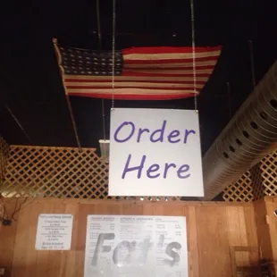 a sign that reads order here