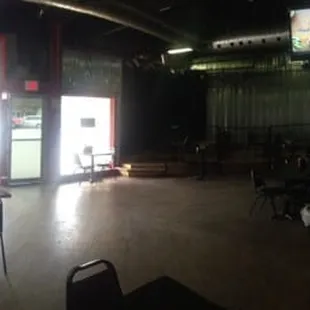 the inside of a restaurant with tables and chairs